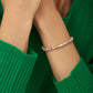 7MM EMERALD CUT TENNIS BRACELET - GOLD