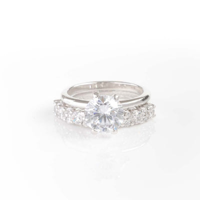 BRILLIANT CUT SOLITAIRE WITH HALF ETERNITY BAND