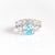 AQUA MARINE CUSION CUT ENGAGEMENT RING WITH FIVE DIAMONDS AND FIVE STONE CURVED BAND