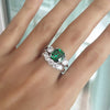 CUSHION CUT EMERALD RING WITH SIDE DIAMONDS & FIVE STONE CURVED BAND