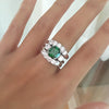 EMERALD CUSHION CUT RING WITH TWO MATCHING CURVED BANDS