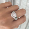 ROUND HALO RING WITH MATCHING ALTERNATING EMERALD FULL ETERNITY BAND